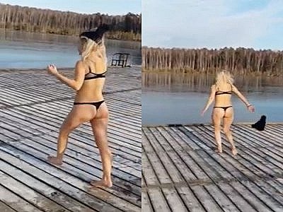 Une blonde saute dans un lac gelé